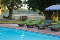 Sparkling swimming pool at the river's edge.