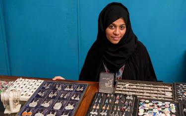Swahili woman selling silver jewelry