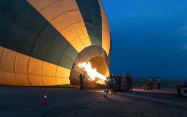 The crew inflates a hot air balloon before take-off