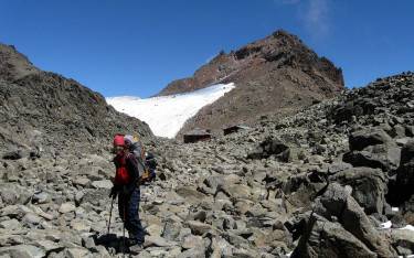 Hiker at Austrian Hut and Point Lenana