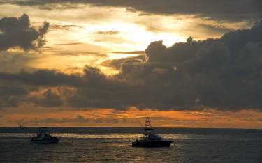 Fishing boats at sunrise in Turtle Bay