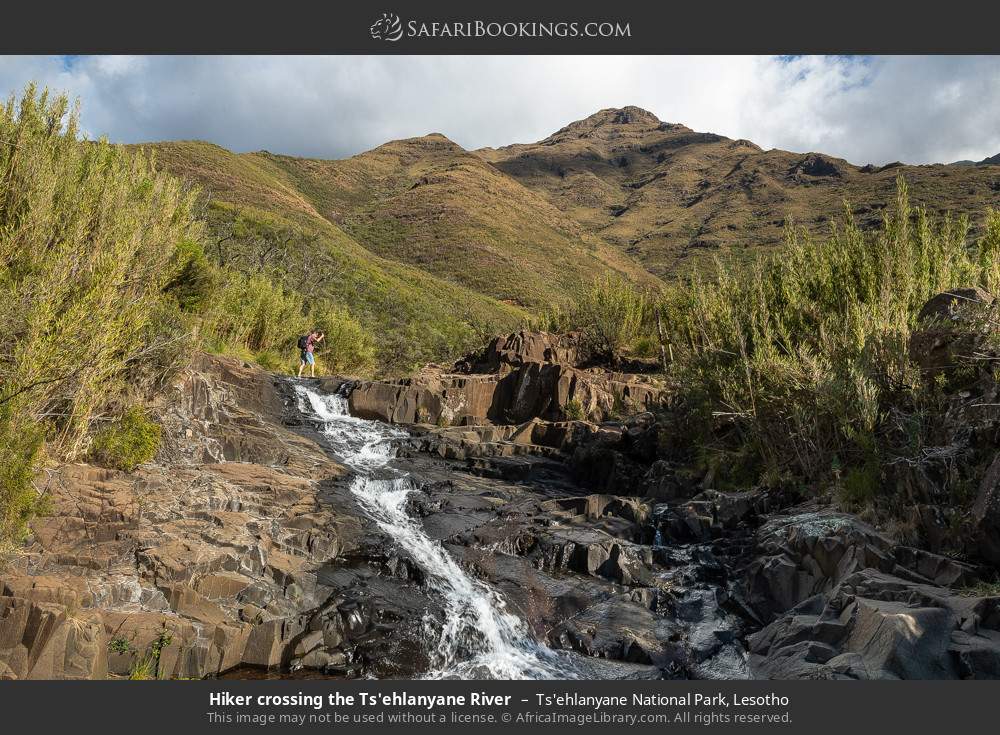Hiker crossing the Ts'ehlanyane River in Ts'ehlanyane National Park, Lesotho