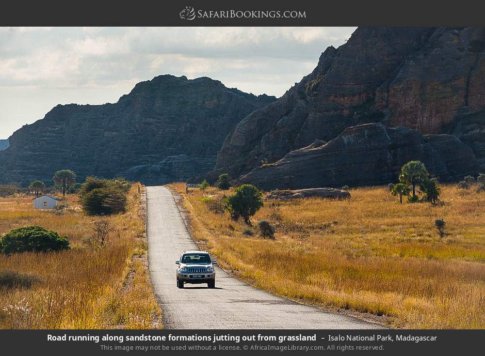 Road running beside sandstone formations in Isalo NP in Isalo National Park, Madagascar