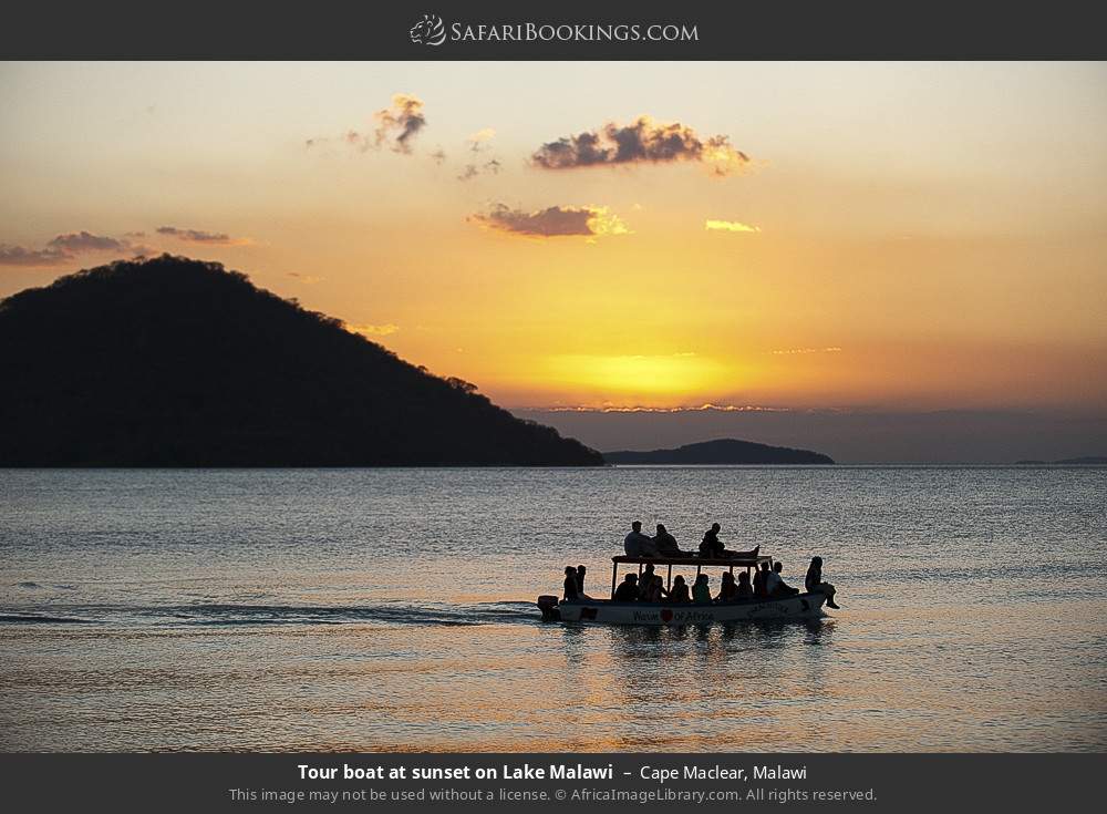 Tour boat at sunset on Lake Malawi in Cape Maclear, Malawi