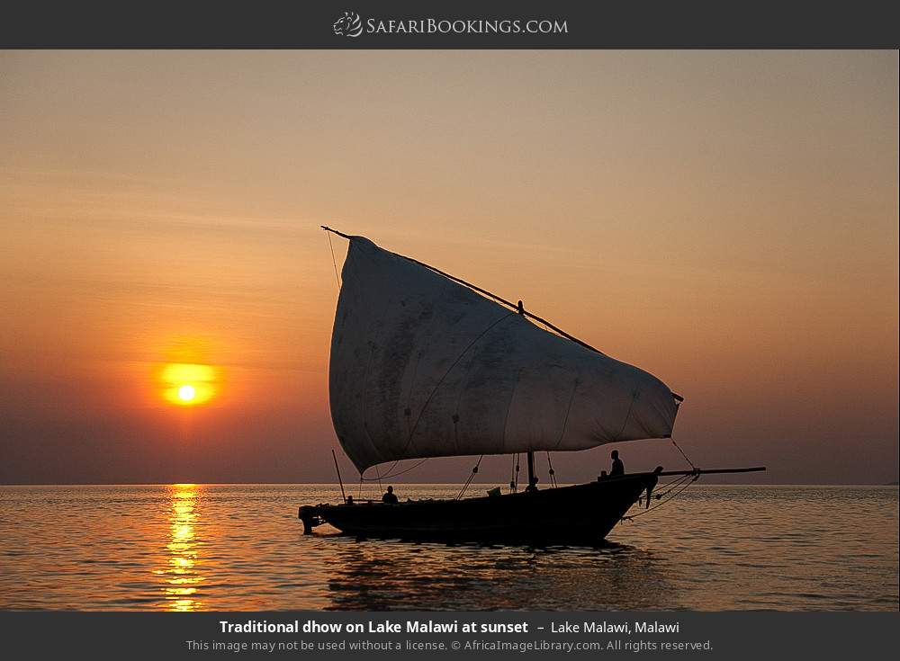 Traditional dhow on Lake Malawi at sunset in Lake Malawi, Malawi