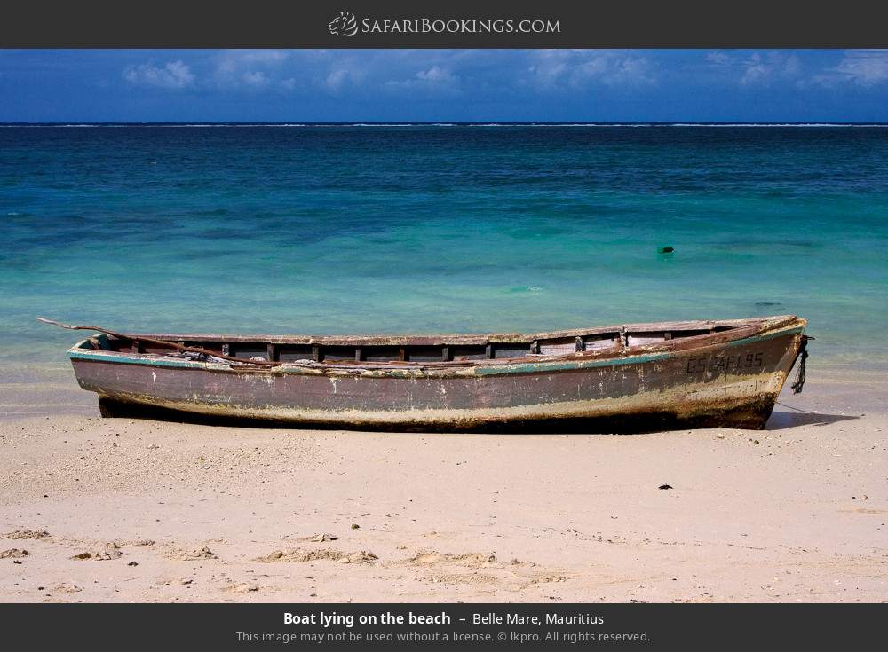 Boat lying on Belle Mare Beach in Belle Mare, Mauritius