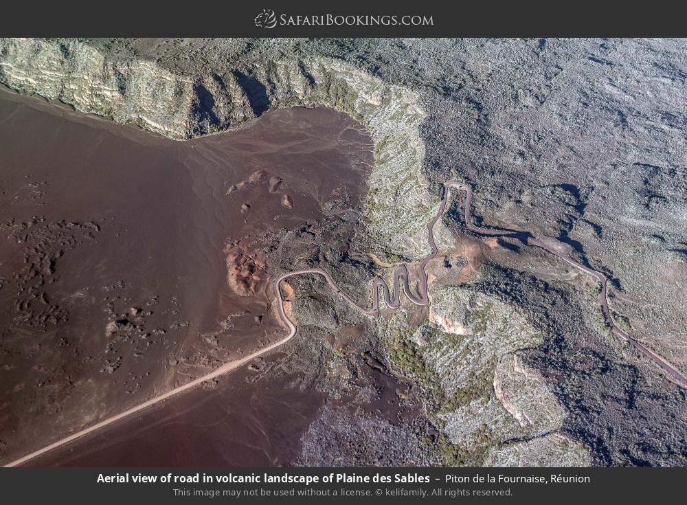 Aerial view of road in volcanic landscape of Plaine des Sables in Piton de la Fournaise, Réunion