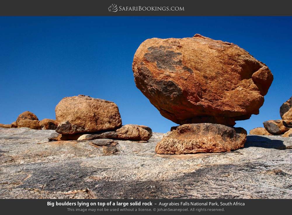Big boulders lying on top of a large solid rock in Augrabies Falls National Park, South Africa