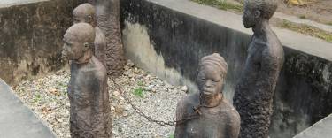 Sculpture of slaves chained in a pit at the Old Slave Market