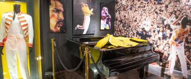 Dispays of Queen paraphernalia including Freddie Mercury's piano at the Freddie Mercury Museum