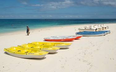 Sea kayaks lying on the beach
