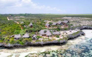 Thumbnail of Lodge built on coral rocks