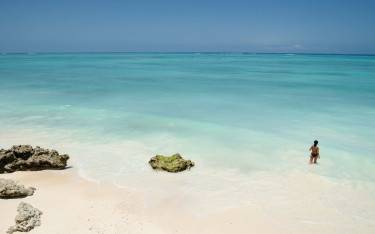 Woman wading in the sea