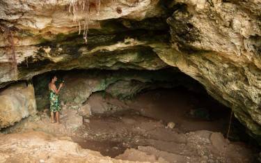 Visitor exploring Twin Caves