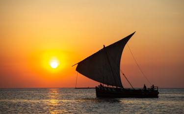 Traditional Swahili dhow at sunset