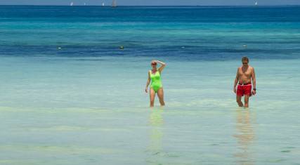 People walking through the water