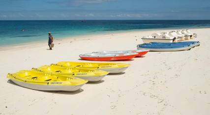 Sea kayaks lying on the beach