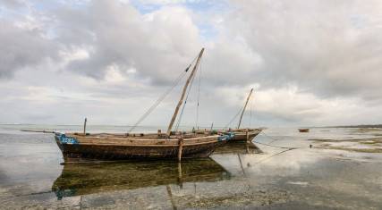 Dhows at low tide on Matemwe Beach in Zanzibar
