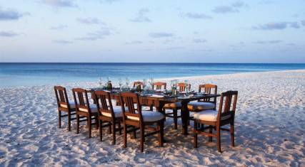 Dining on the beach at Mnemba Island Lodge on Mnemba Island
