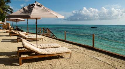 Lounge chairs next to the ocean