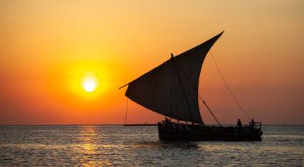 Traditional Swahili dhow at sunset
