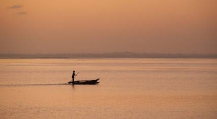 Fisher at  sunrise