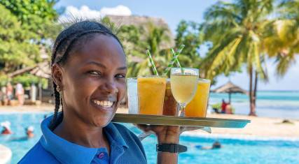 Thumbnail of Waitress carrying drinks to the beach