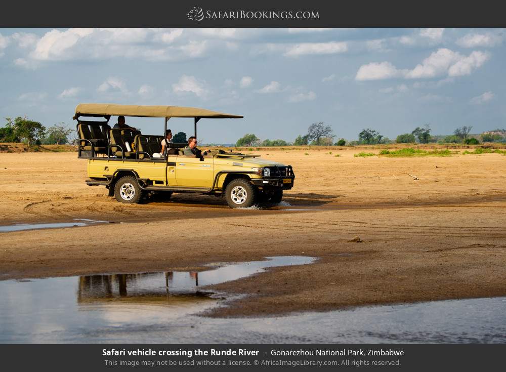 Safari vehicle crossing the Runde River in Gonarezhou National Park, Zimbabwe