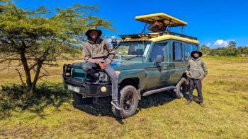 Director and Senior sales staff during a safari